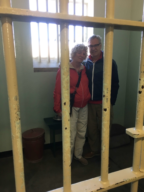 Michael and I getting a dose of reality as we stood inside Mandela's Robben Island cell where he spent 18 of his 27 years in prison. He slept on a thin mat on the floor his head touched one wall and his feet the other.