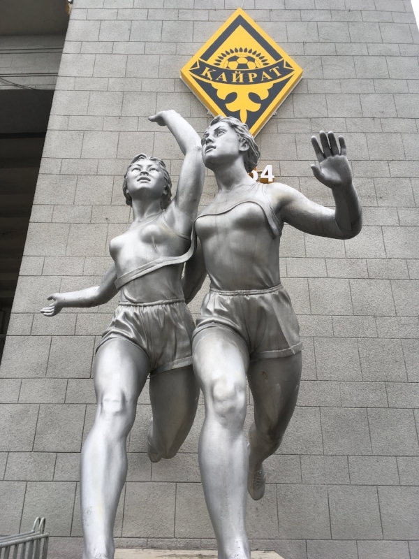 The statues outside the stadium built in the 50's featured woman athletes. But during the track and field event, the male medal winners got large cash prizes. The women got flowers. What?