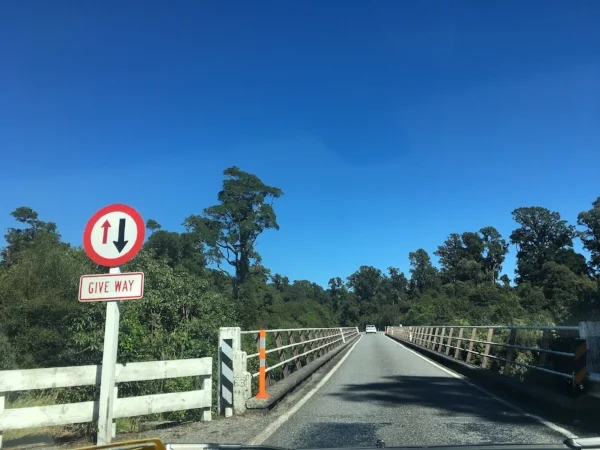 "You go. No, you go. No really, I insist, you first" It wasn't that polite when it came to the right of way on single lane bridges. Fortunately, we never had to back up.