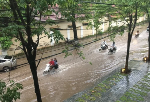 The view from our window. We watched as weary commuters made the best of it on bicycles, motorbikes, tu tuks and we even saw pedestrians crossing the street holding their shoes up high. At least it was warm!