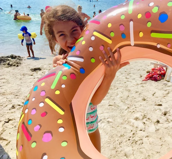 Colette is ready to dunk her floating donut in the warm Mediterranean Sea.