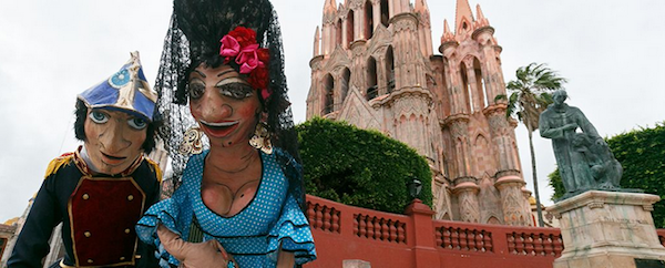 Sit on a bench in El Jardin for a while and you’ll collect all kinds of new friends. Including giant paper mache Mojigangas!