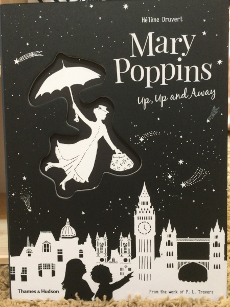 The cover of Mary Poppins: Up, Up and Away by Helene Druvert based on the work of P.L. Travers. Thumbnail above of Little Lion with Mary Poppins and Burt at Disneyland. Yes, she is dressed as a lion, hence her nickname. Posted with permission.