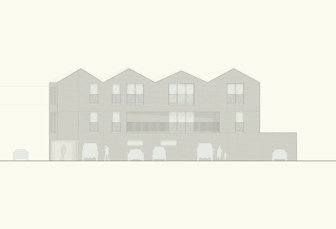 In contrast to the narrow street frontage the long north elevation is characterised by four shallow pitched roofs, creating a domestic character overlooking the carpark.