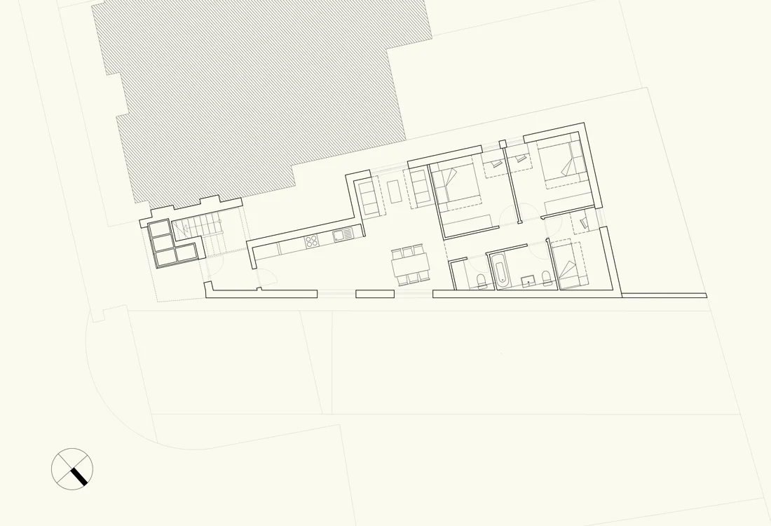 Ground floor plan. A communal entrance lobby leading to a 3 bed 5 person flat with a private garden to the rear. Clerestory windows have been provided facing the carpark to maximise light whilst maintaining privacy.