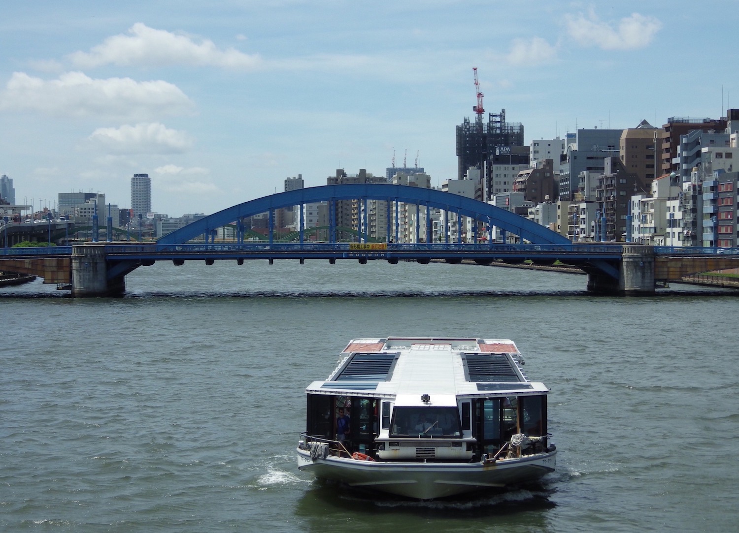 A water bus on the Sumida River, as seen from the Azuma Bridge, near Tokyo's Asakusa district.