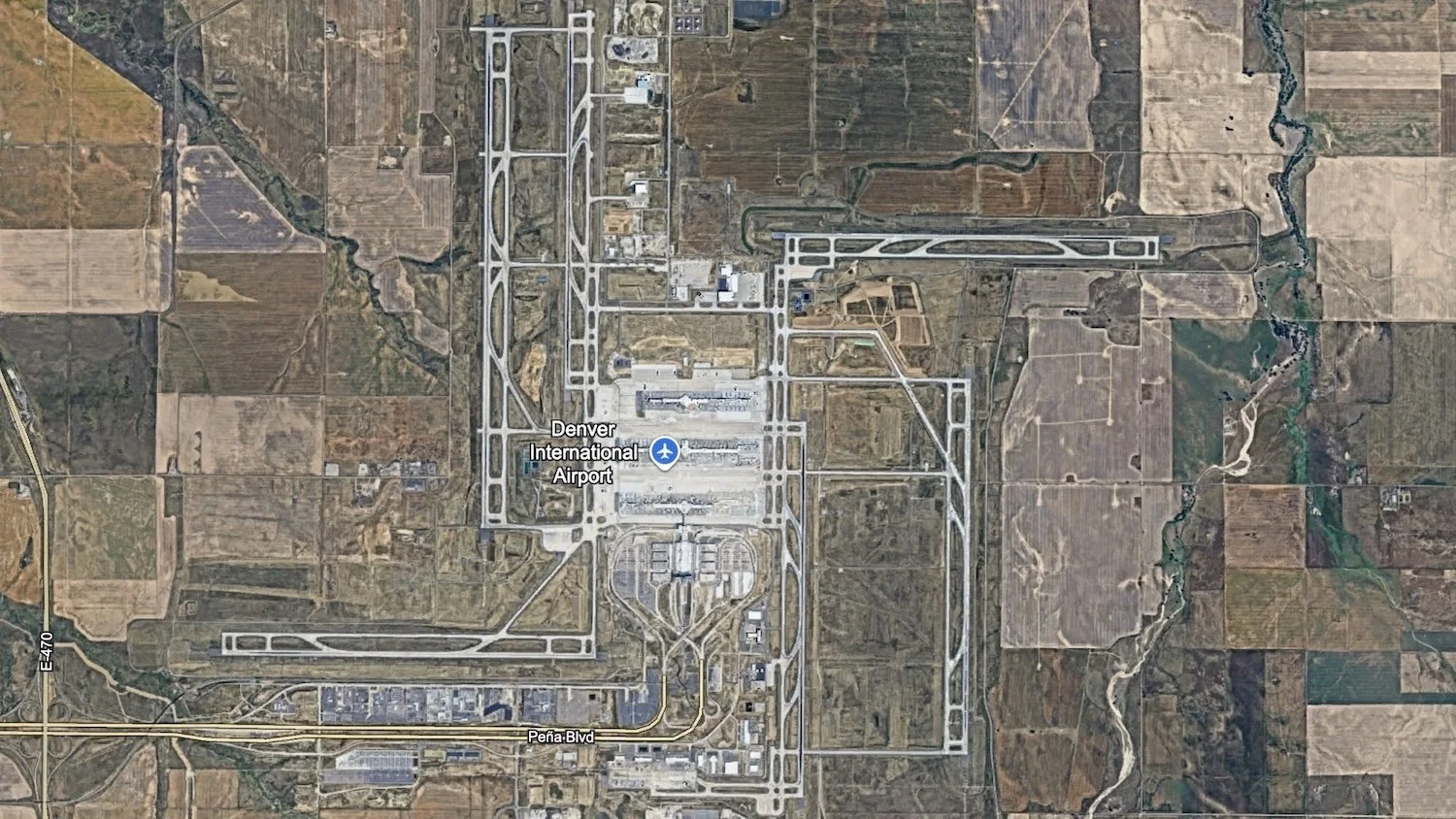 google earth satellite image pinwheel swastika runways denver international airport