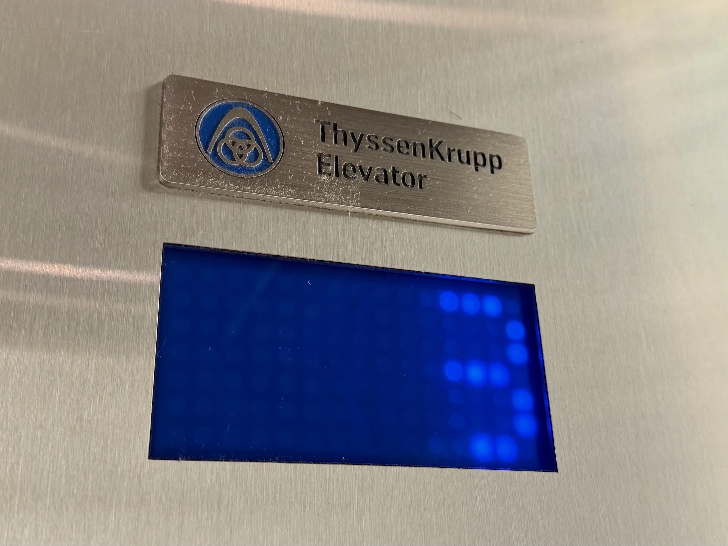 thyssenkrupp three-ring logo westin hotel elevator denver international airport