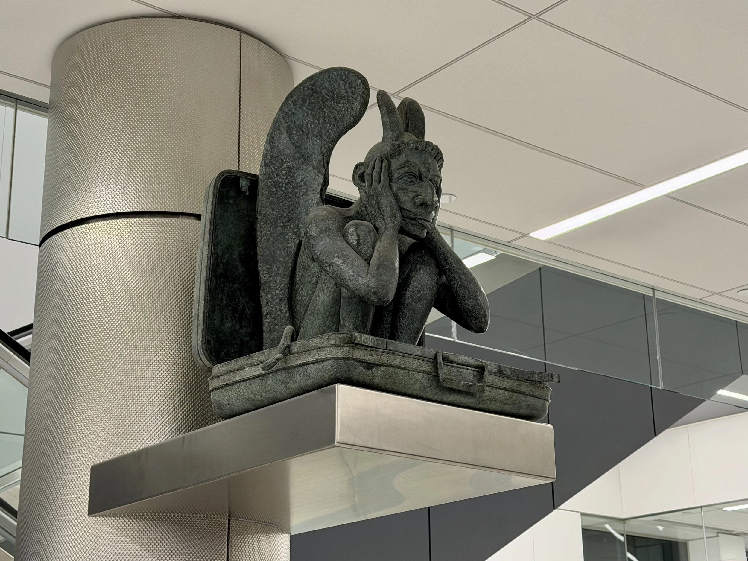 notre denver gargoyle samsonite suitcase dia airport baggage claim area