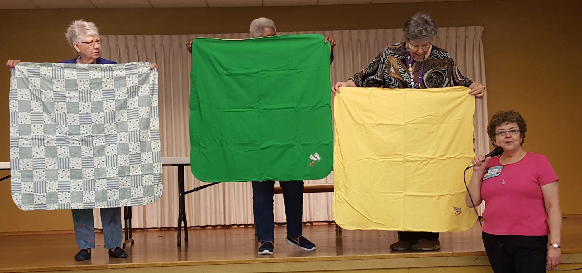judy brennan embroidered receiving blankets for community quilts.jpg