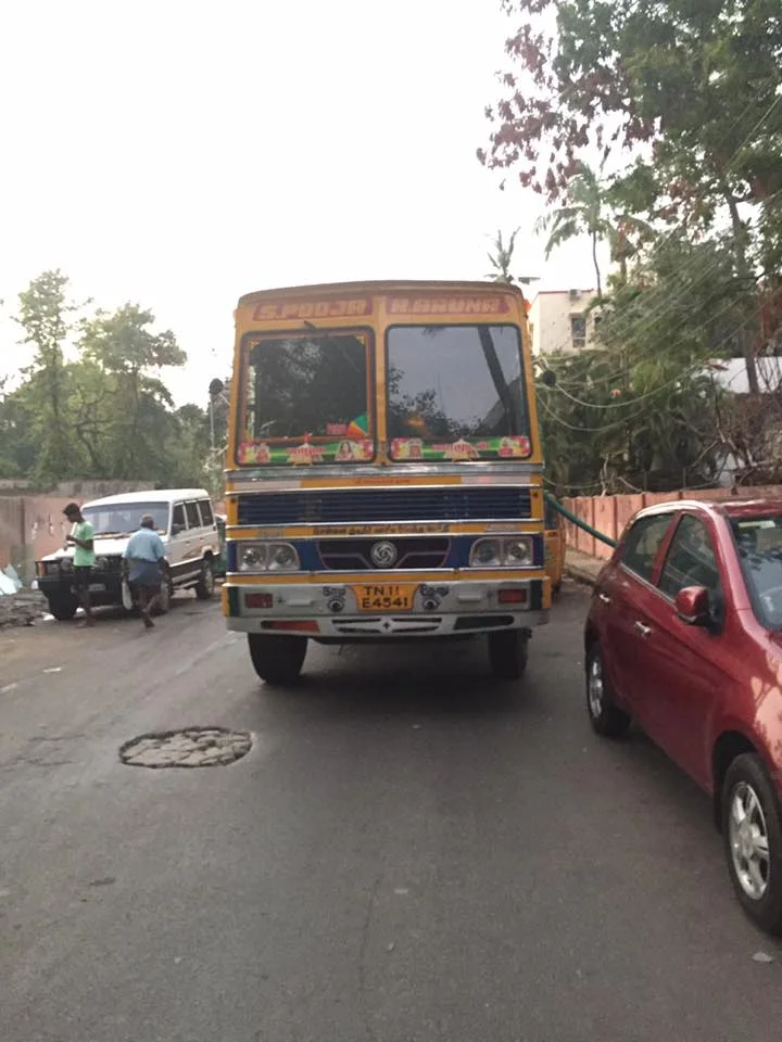 A typical heavy-duty work truck, like an 18-wheeler in the US. They're always painted this shade of yellow and always decorated with colorful stickers of movie actors, politicians, or maybe painted on the side with flowers.