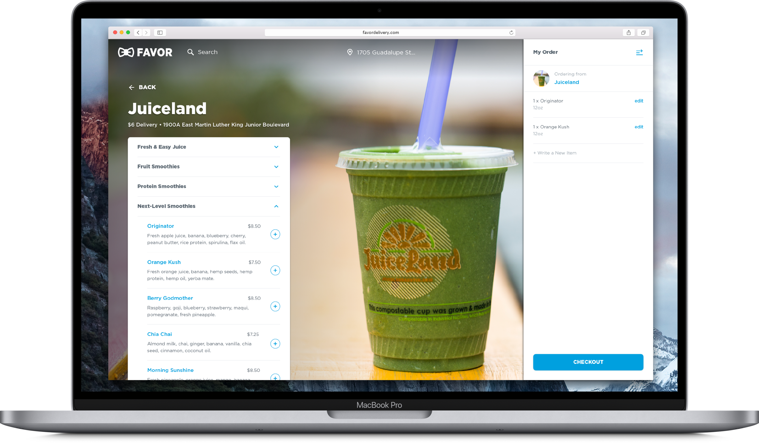 A laptop screen displaying an online order from Juiceland, featuring a green smoothie in a clear plastic cup with a lid and a purple straw, with the Juiceland logo and text on the cup.