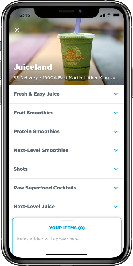 Smartphone displaying Juiceland menu with categories like Fresh & Easy Juice, Fruit Smoothies, Protein Smoothies, and a photo of a green juice with a straw at the top.