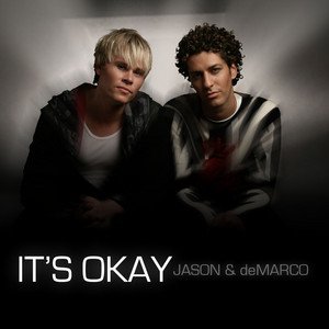 Two young men sitting close together against a dark background with text that says 'IT'S OKAY JASON & deMARCO'.