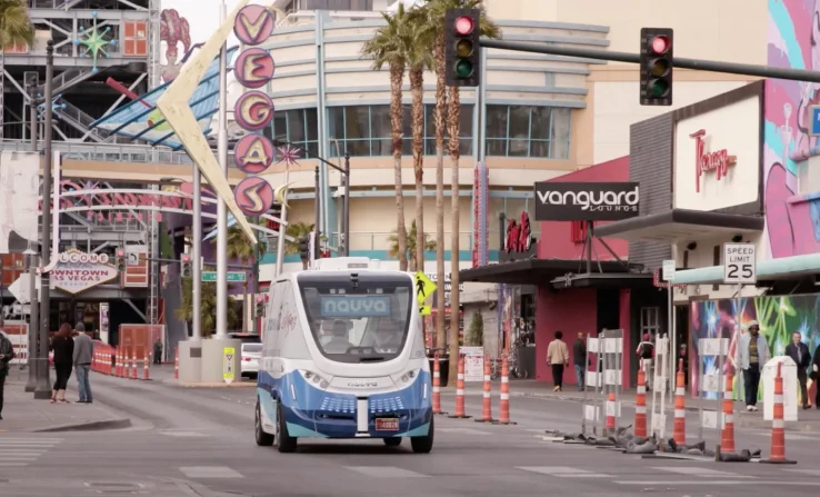 The driverless electric shuttle carries passengers in a test program in downtown Las Vegas.