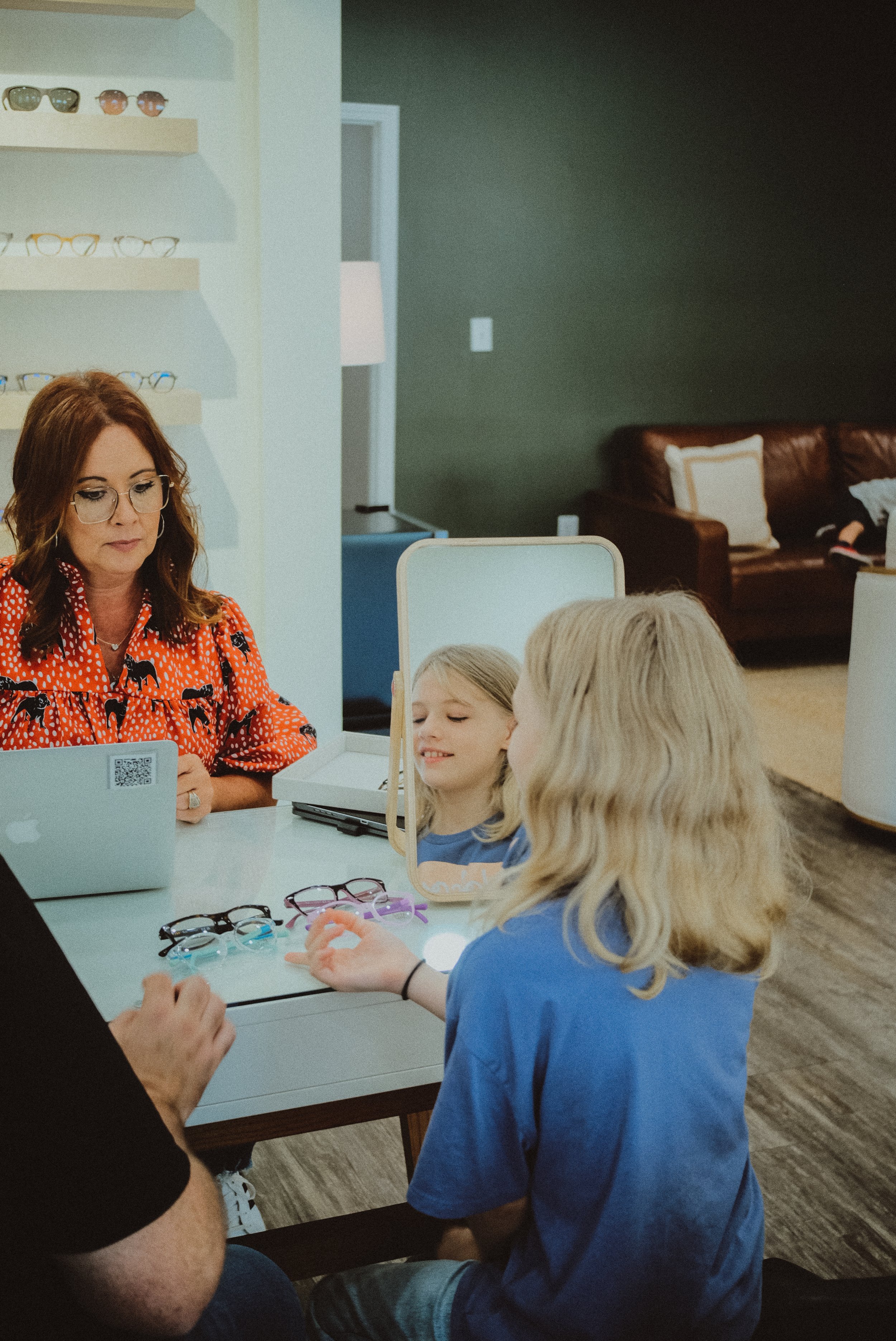 young kid getting eye exam from optician in Carrollton, GA