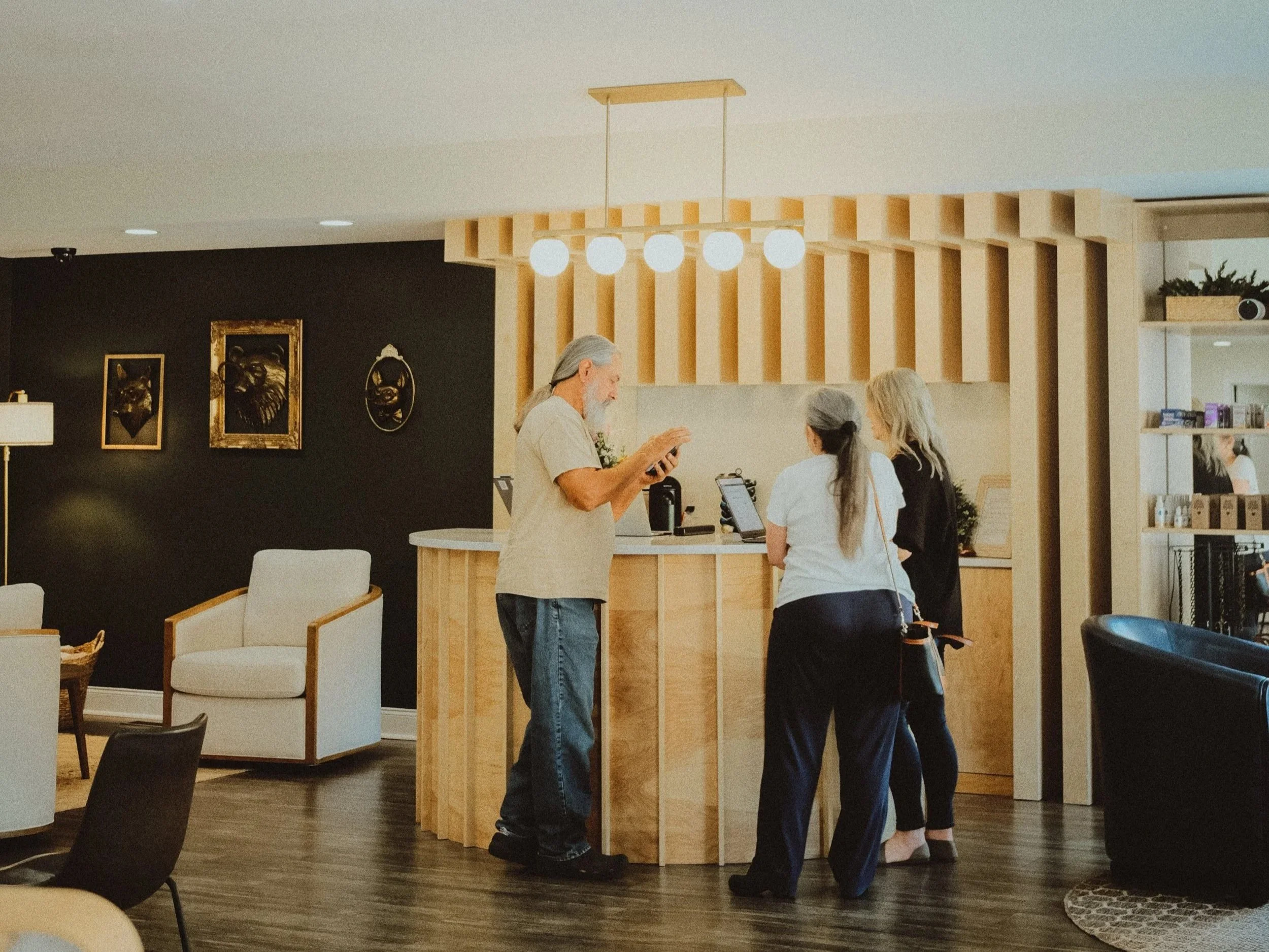 older couple discussing glasses with eye care specialist in Carrollton, GA