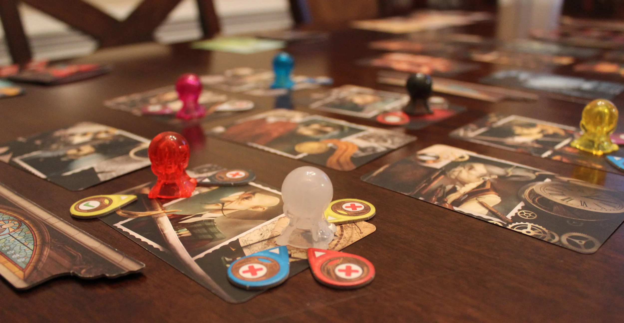 Players voting on whether they agree with the other player's choices using the teardrop shaped "clairvoyancy tokens."