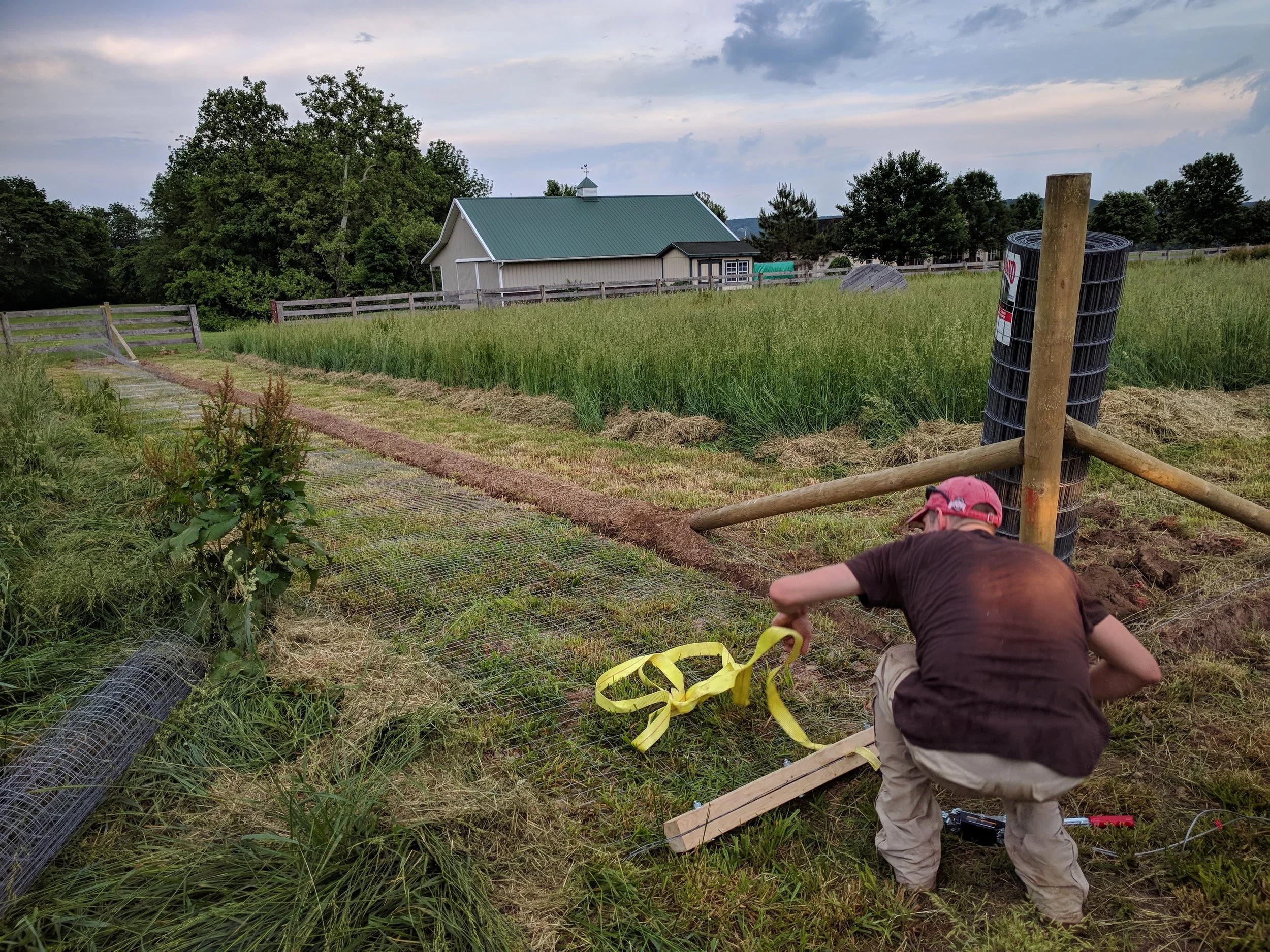 Jared fashioned a fence stretcher!