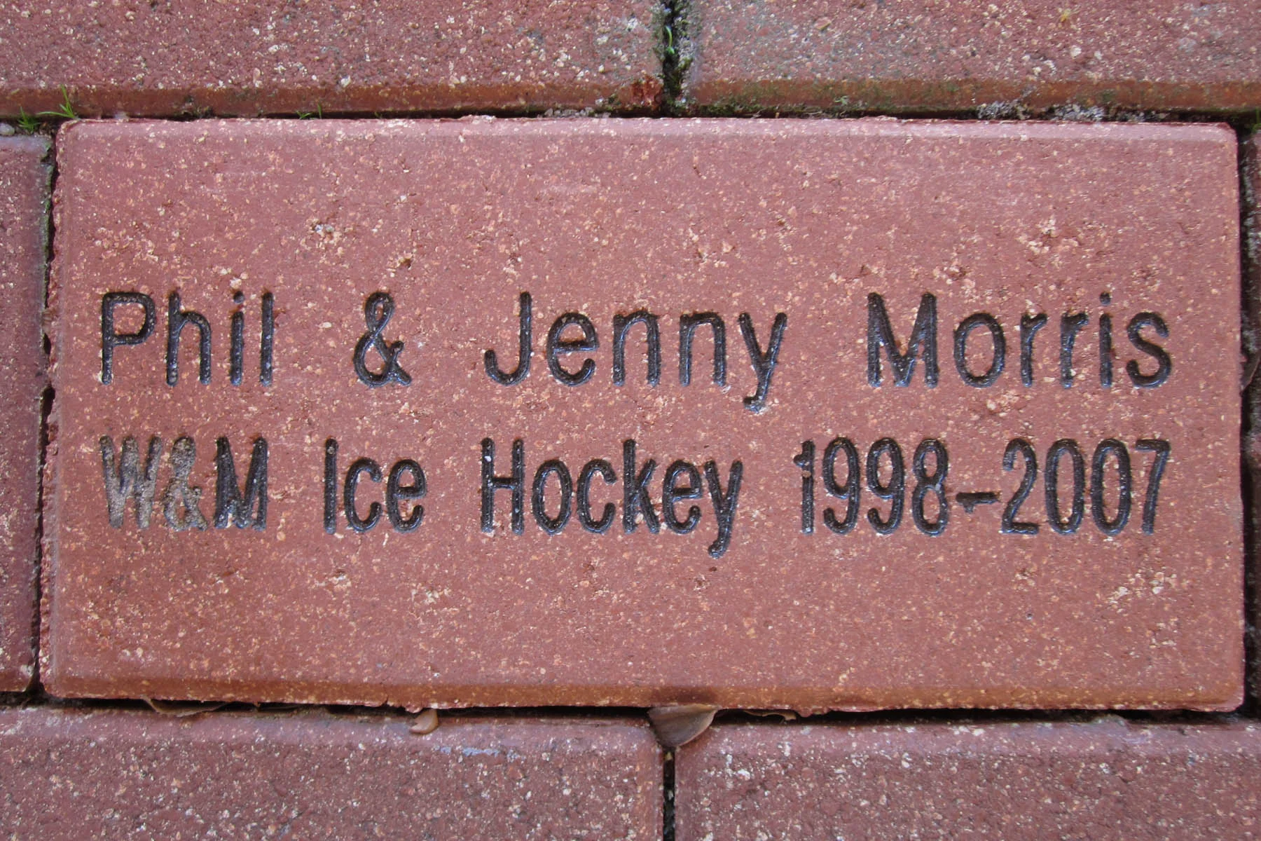 The Tribe Hockey booster club honored the commitment Phil and Jenny Morris made to the team by placing a brick in the Elizabeth J. and Thomas C. Clarke ’22 Plaza of the Alumni House.