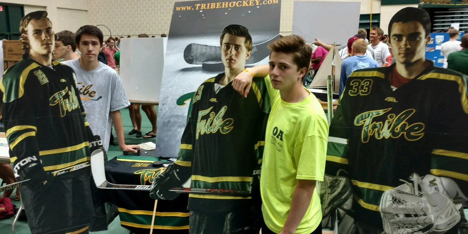 Ben Constatine ’19 (left) and Conor Rooney '18 (middle) joined team manager Colleen Heberle ’18 as well as players George Andros ’19, Captain Julian Kell '18, President Derek Prario '18, Alex Hayes ’19, and Jack Jenet '19 at the Tribe Hockey booth.