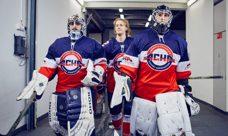 W&M senior Julian Kell, center, enters the arena with his ACHA national teammates. (Photo courtesy ACHA)