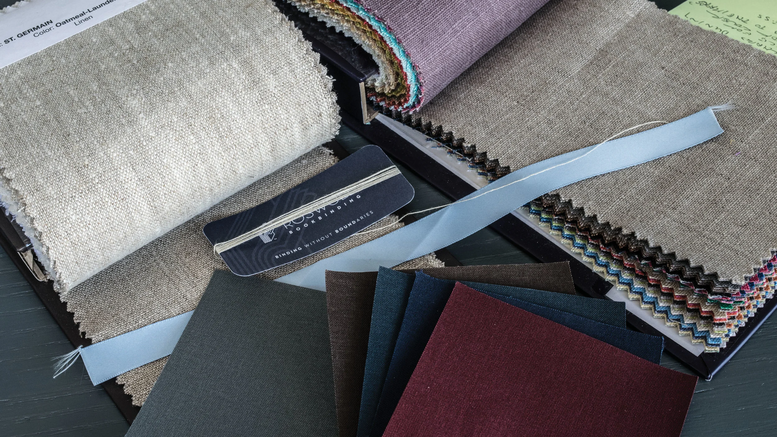 Choosing materials for the cover, slip case, thread, and ribbon. 