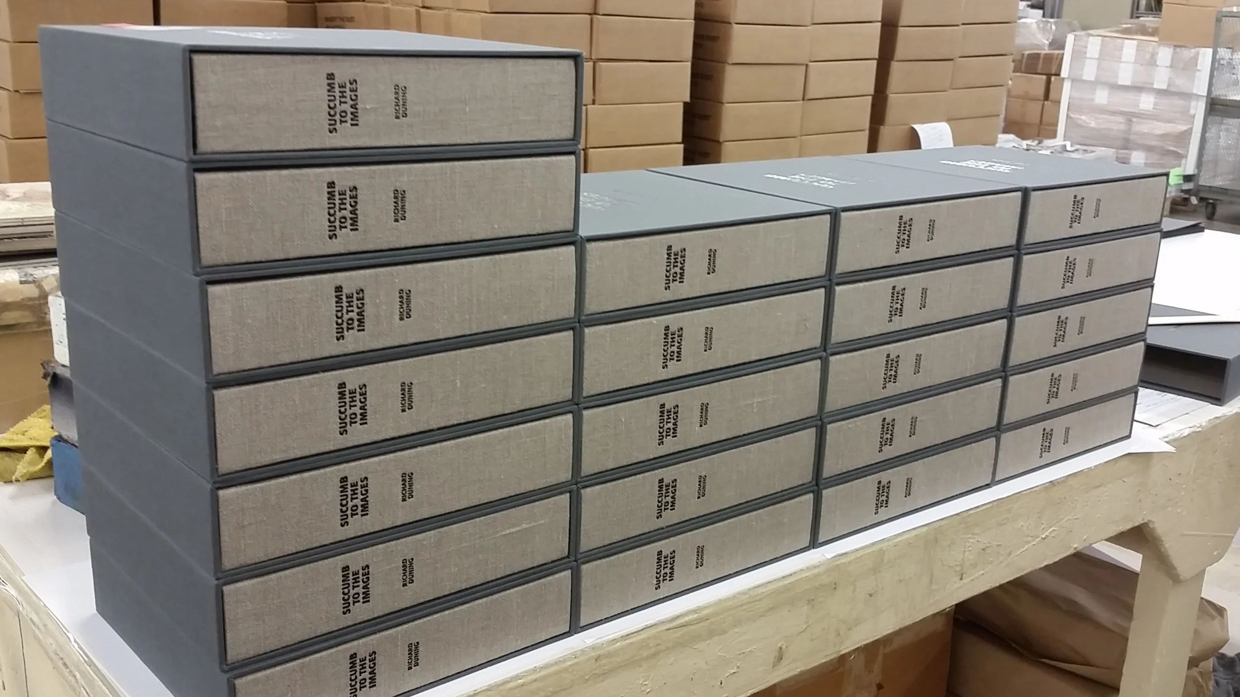 Completed books in their cases. 