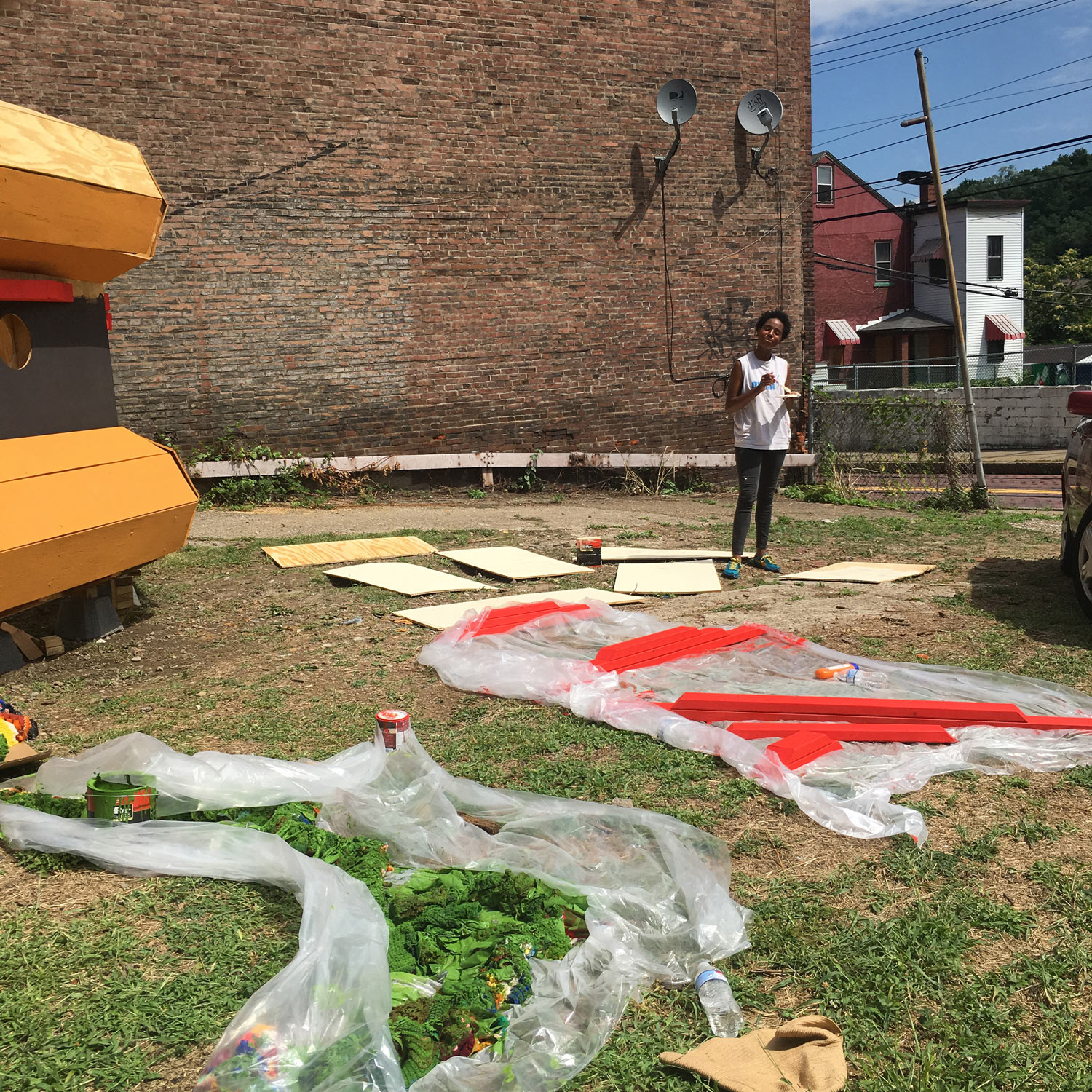 Volunteer Aisha White waits for the ingredients to dry. Photo credit: Amy Masters