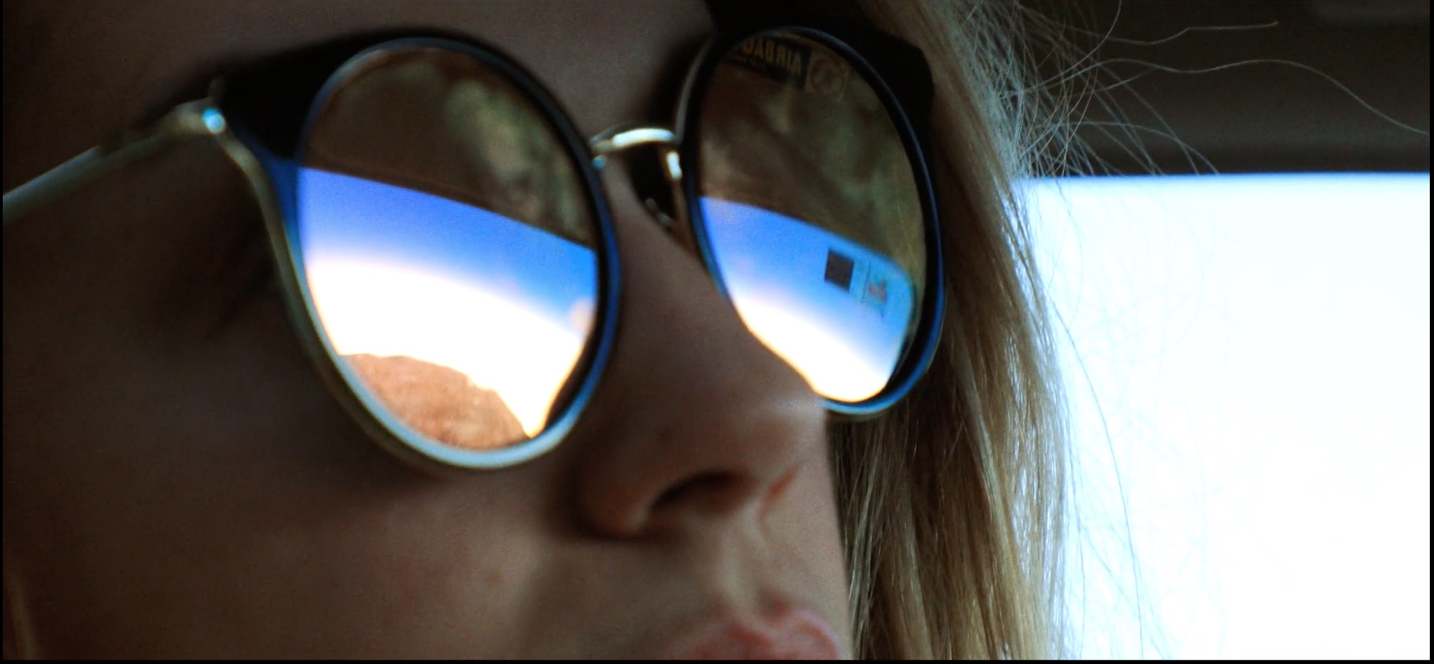 Erin Granat glides across the 395 highway in Sacred Shit.