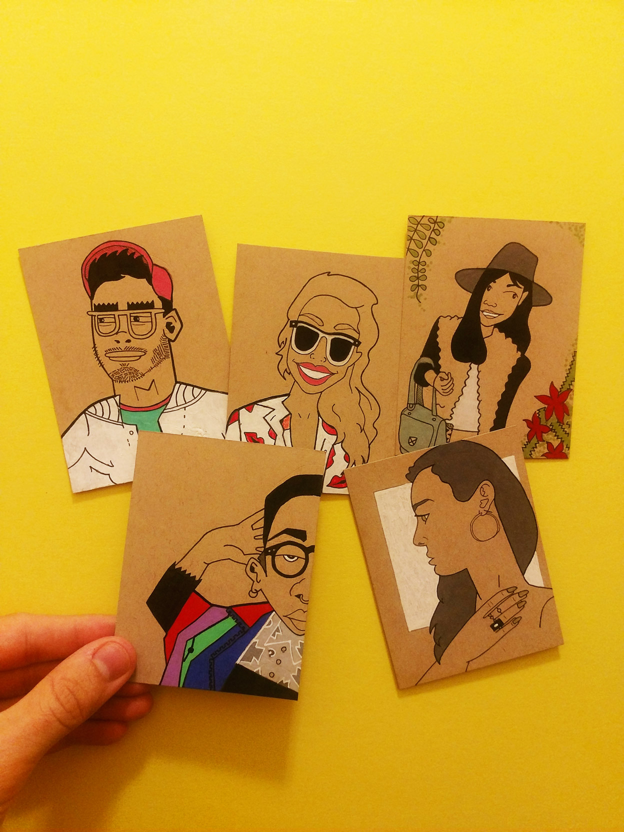 From left to right, top to bottom: Andy, Ricky, Yiwei, Kadie and Lizzy. ( Instagram Buddies Trading Cards: Series #1); Pen, colored pencil, markers & acrylic paint on 4x3 inch cards of Strathmore toned tan mixed media paper)