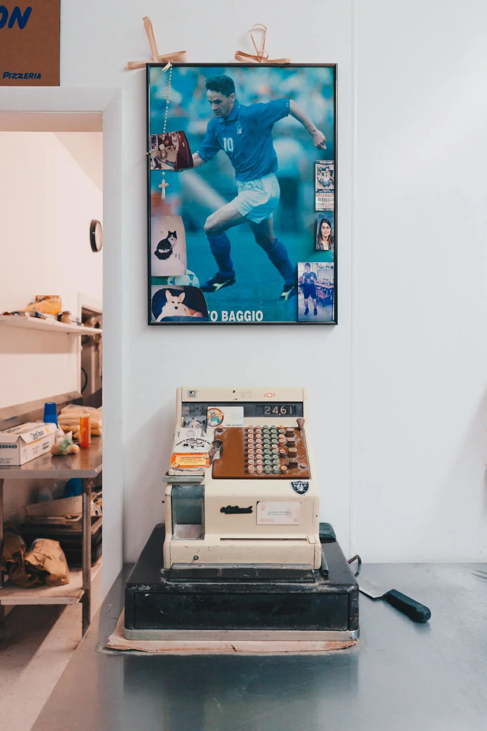 Lacopo’s No. 1 A scene inside Lacopo’s Pizzeria, a West Side staple since 1989, of a vintage cash register and famed Italian footballer Roberto Baggio. This photograph was featured in our March 2018 story Lacopo’s Pizzeria .