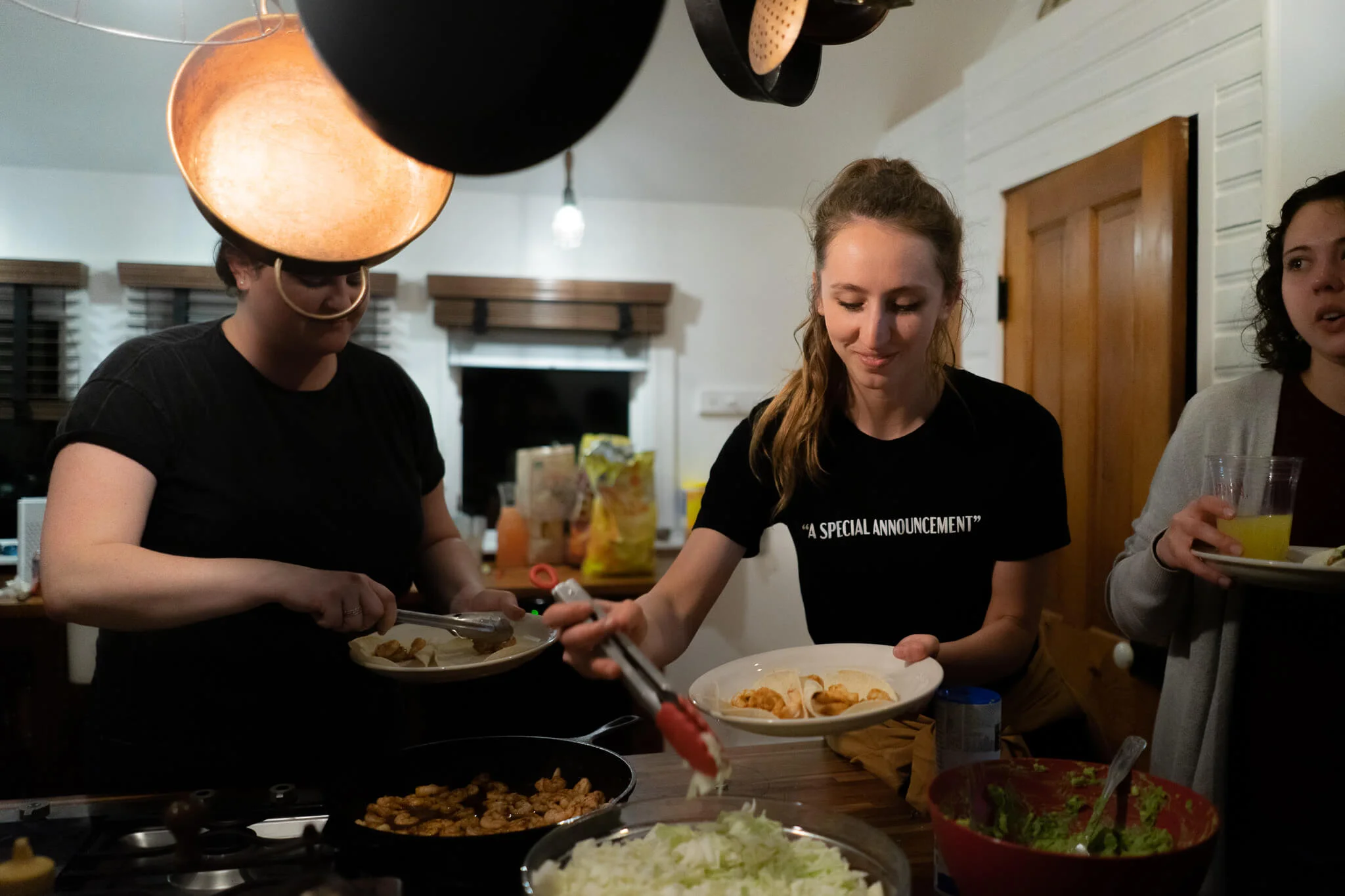 Helen Cramer wears “ A Special Announcement ” tee while enjoying another dinner by Kathryn Keur, or “Kath Makes Food” .
