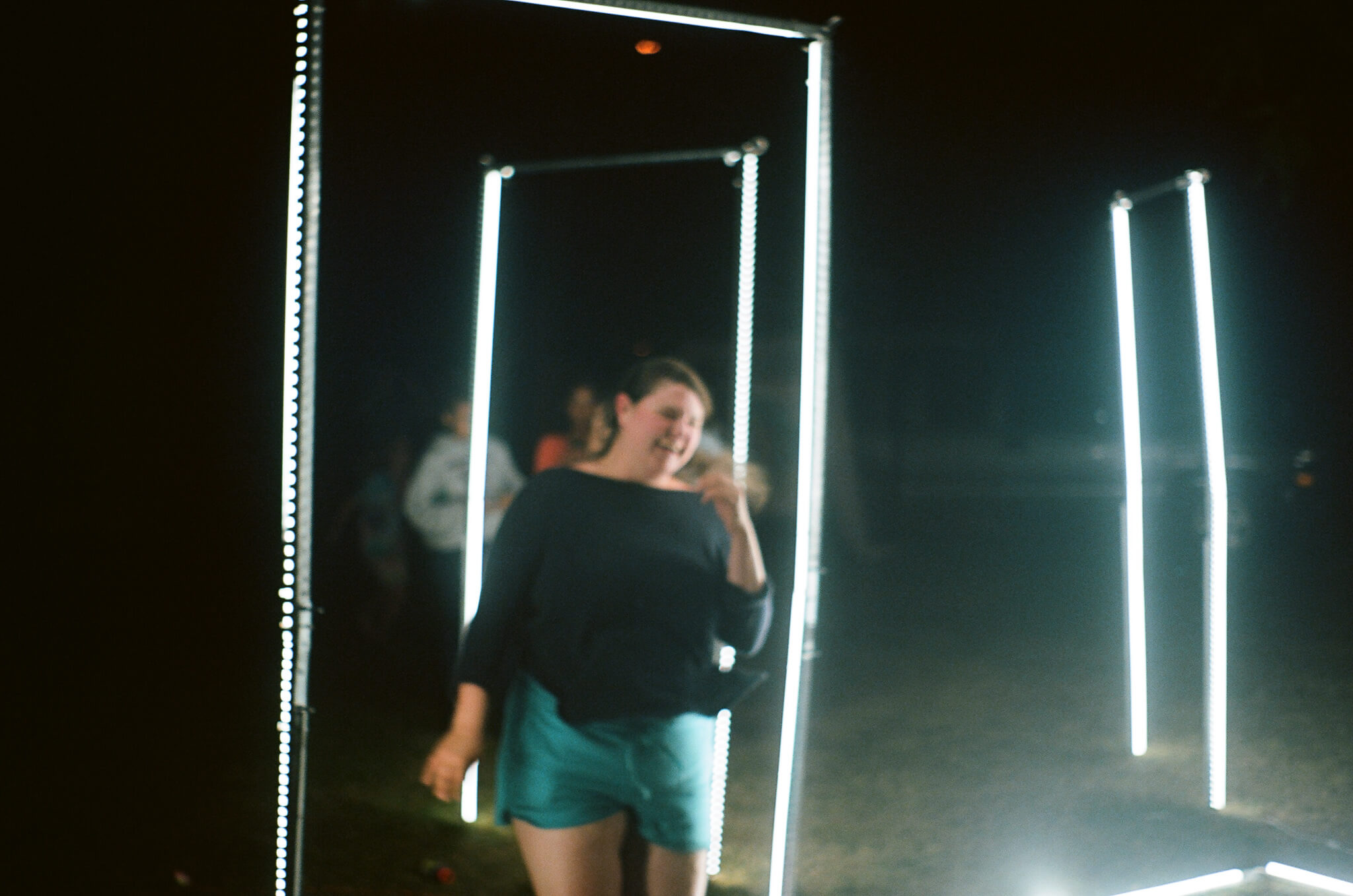 Kyra McAndrews running inside GIIIVENS ’ light sculpture.