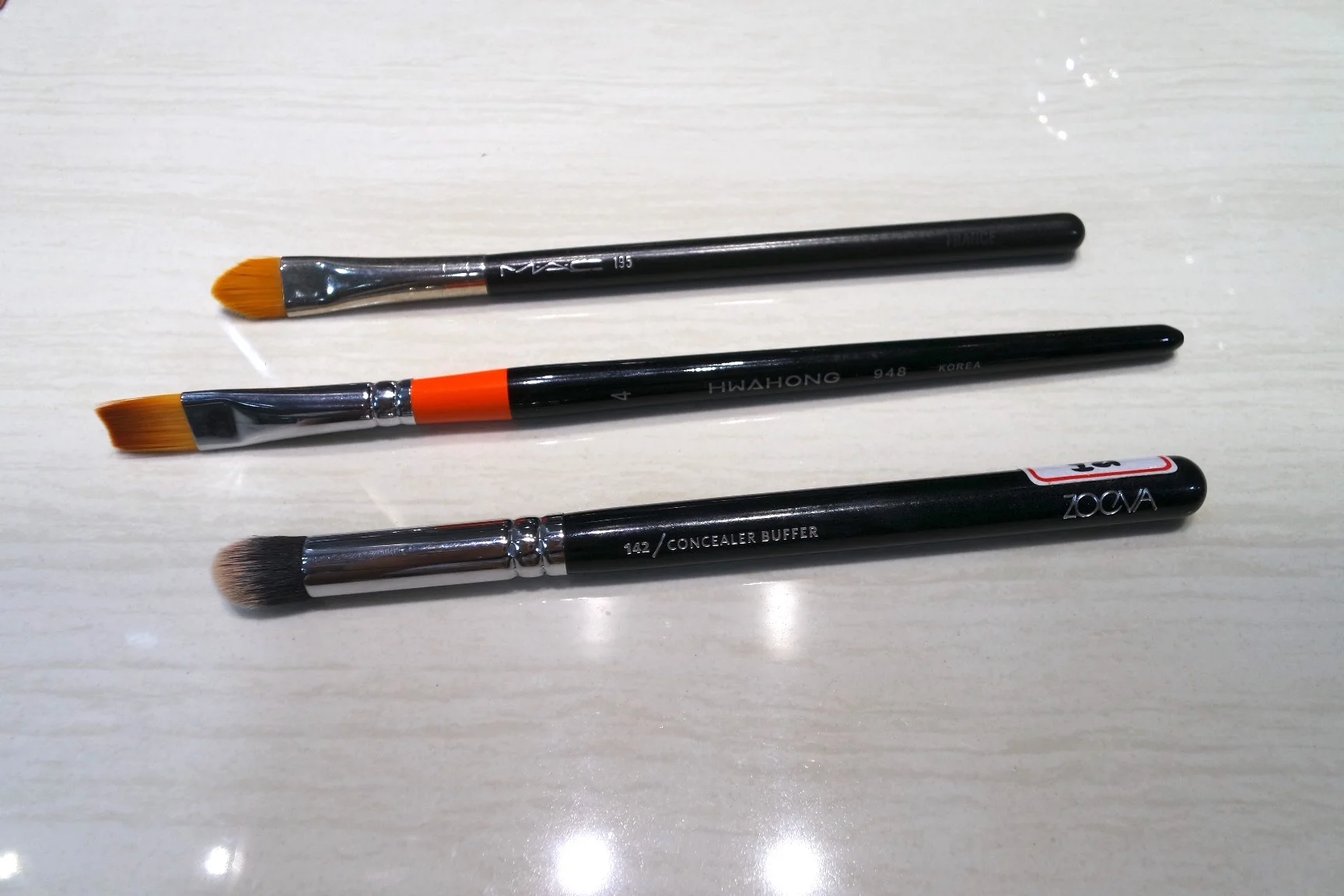 Concealer brush showdown (T-B): MAC 195, Acrylic Paint Brush, Zoeva 143
