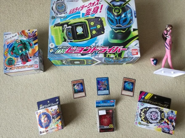 Gordon’s loot - Kamen Rider, Yu-Gi-Oh cards, Evangelion figure