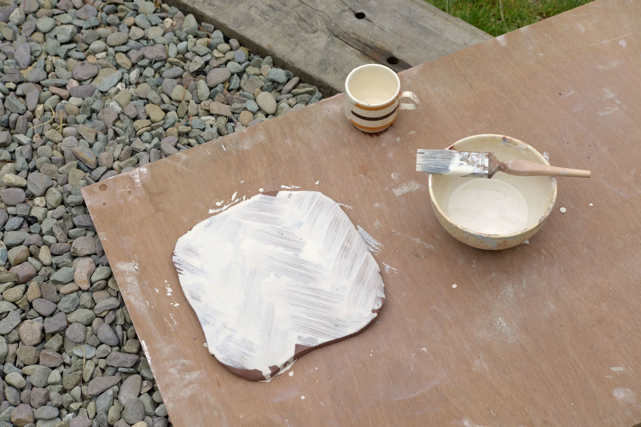 We paint on thick porcelin & dispex slip. 