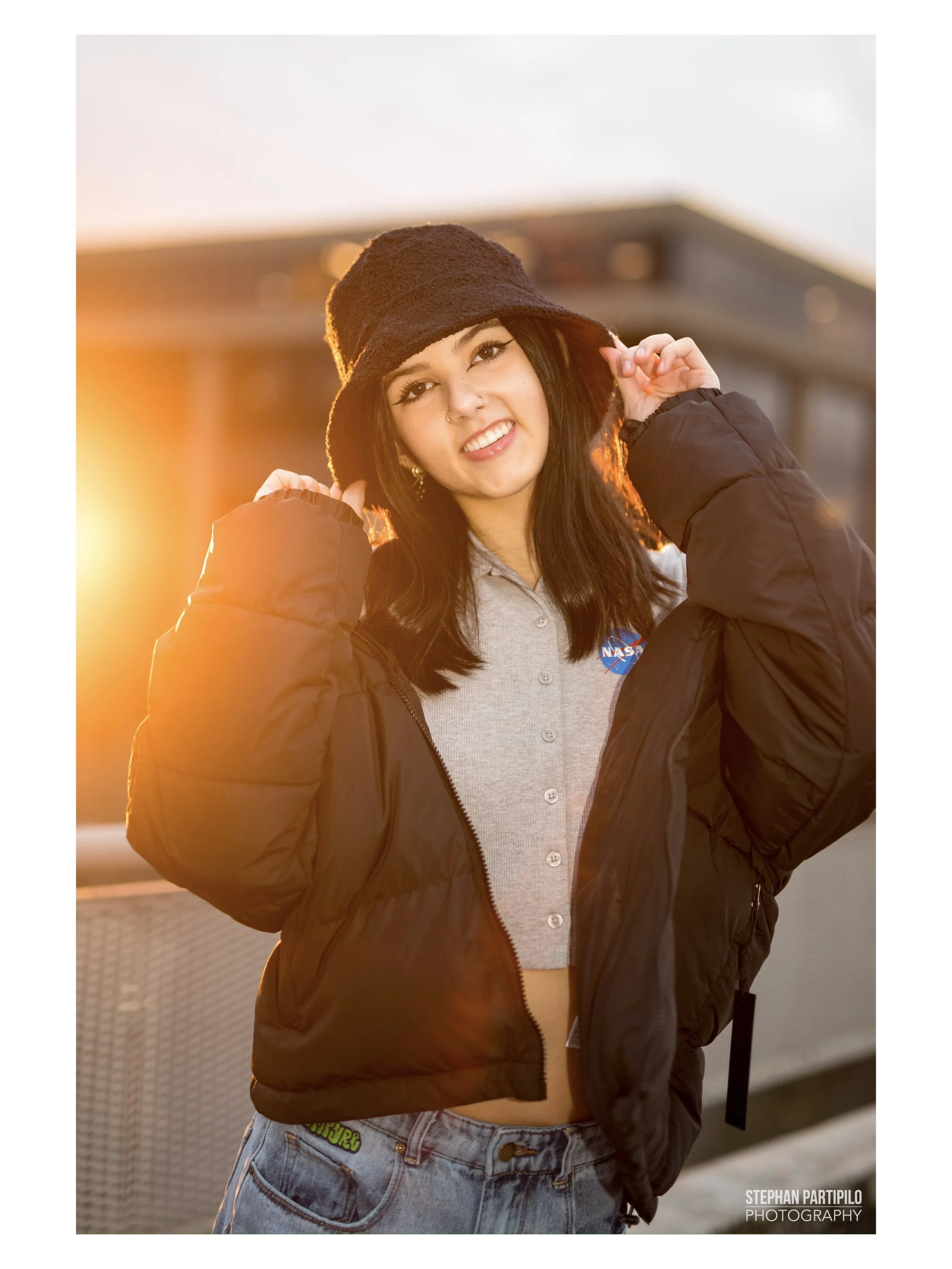 Teen model Leiya Locke wearing streetwear on a rooftop during a photoshoot by Stephan Partipilo.