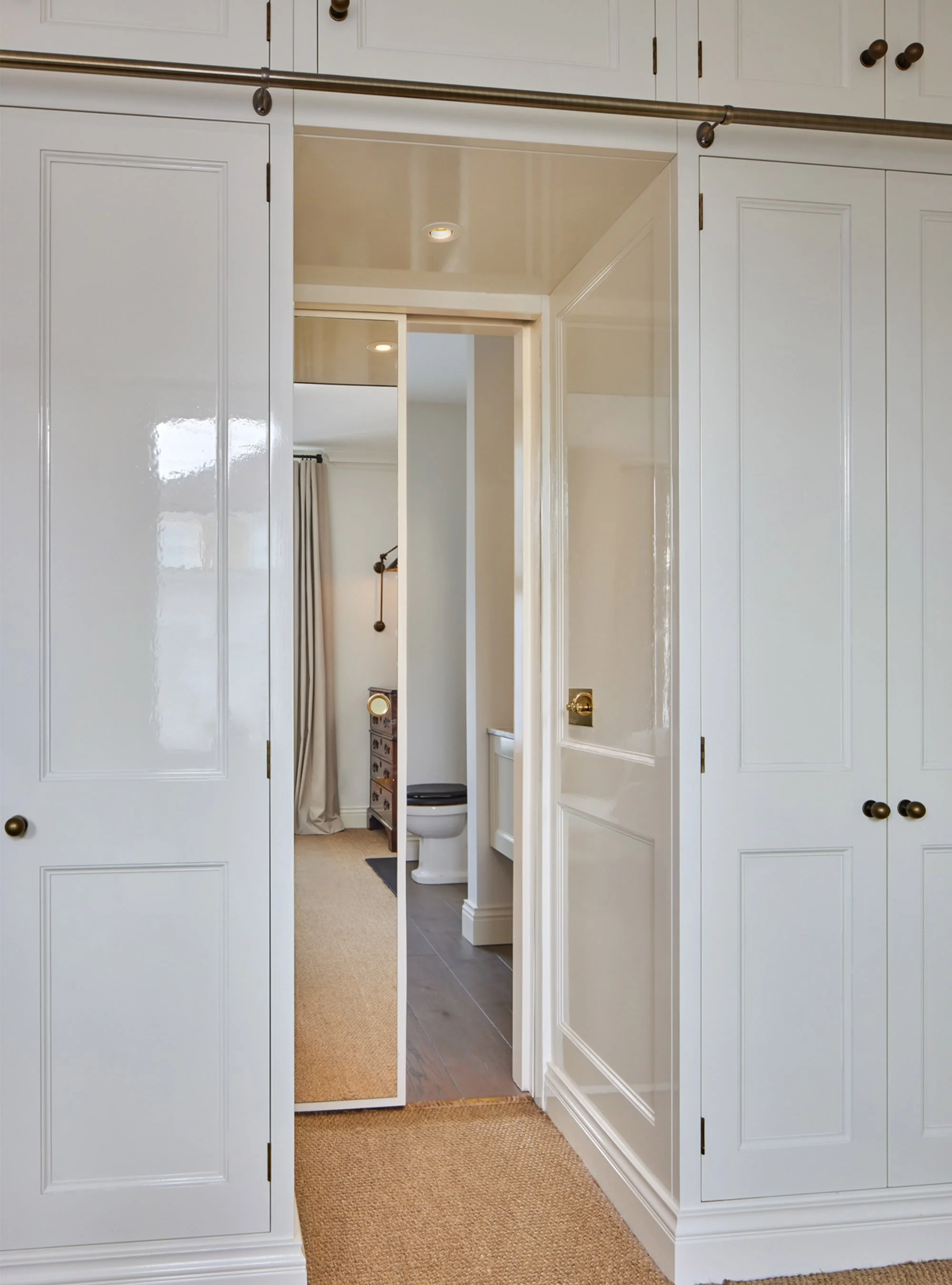 Hackney-luxury-townhouse-_0008_Clever-cupboard-diviver-between-bedroom-ensuite-hidden-door.jpg