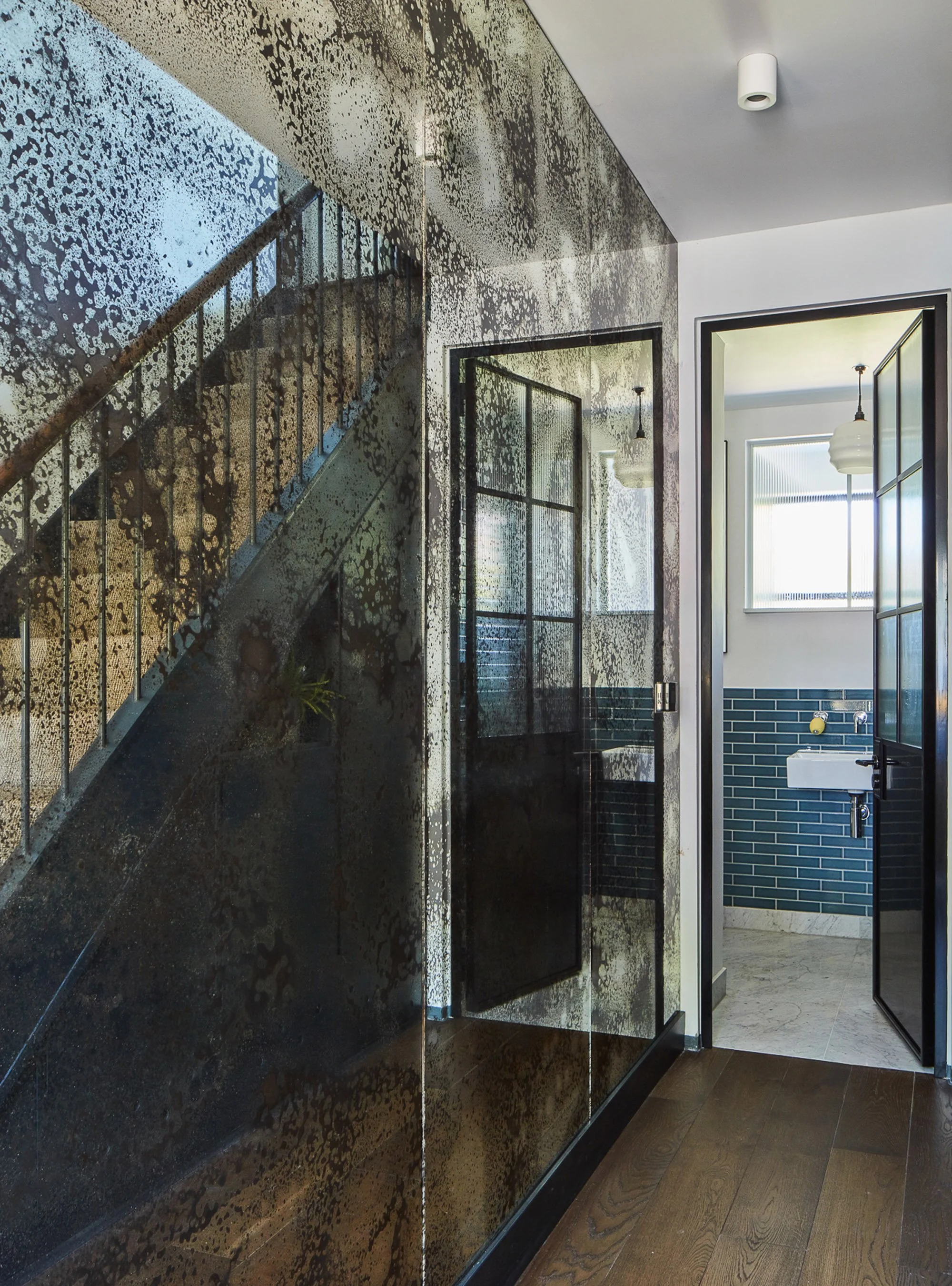 Young-professional-home_0003_Foxed-glass-entrance-hall-and-stairway.jpg