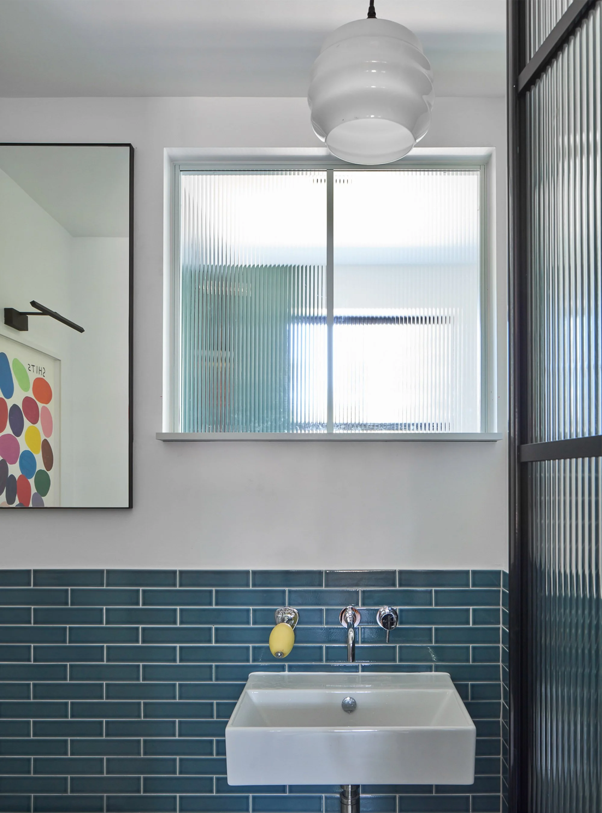 Young-professional-home_0002_Simple-blue-metro-tile-bathroom-black-white-theme.jpg