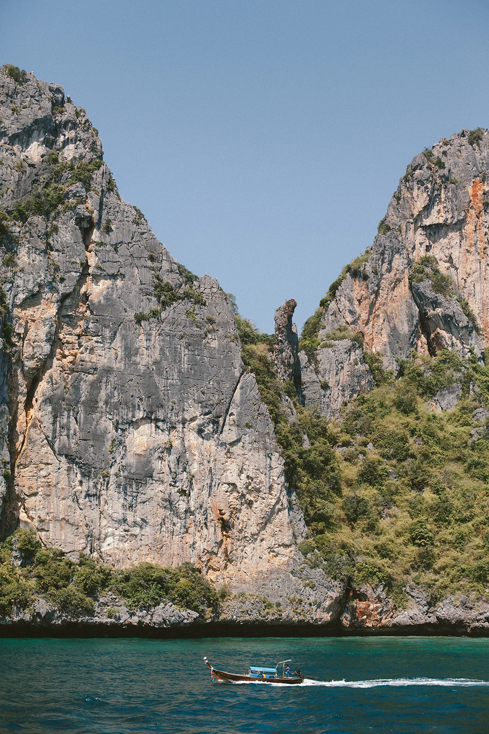 A longboat cruising around Phi Phi Leh