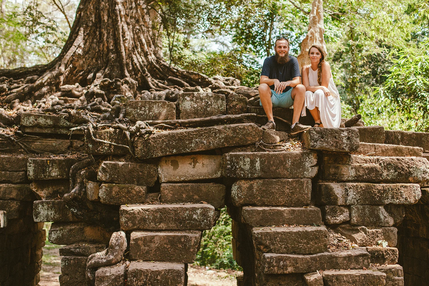 Sitting near an amazing tree on the way from Bayon Temple, in Siem Reap