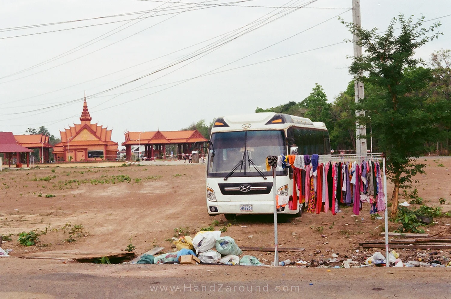 Laos and Cambodia border, on Cambodia's side with the orange building (the border) in the back. Interesting collection of stuff, isn't it?!