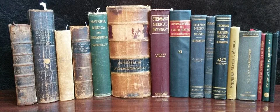 Collection of antique, medical reference books where cannabis is listed as medicine (circa: pre-1940s and the demonizing of hemp).