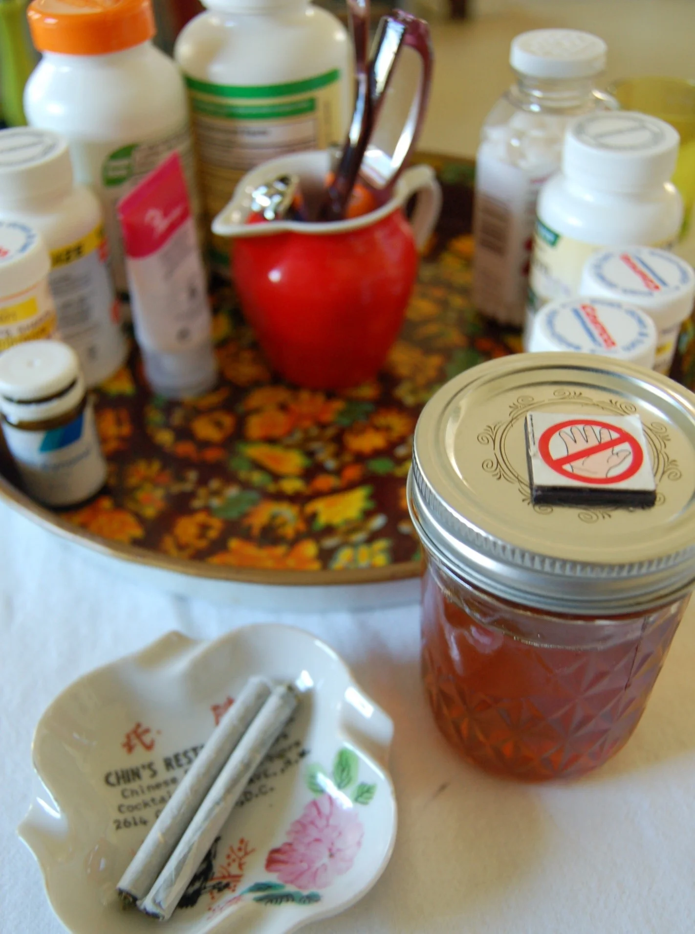 sharon's Past Prescription medication and supplement tray became her smoking and cannabis medication tray; now filled with tincture, salve, and smoking tools. Photo: Sharon Letts