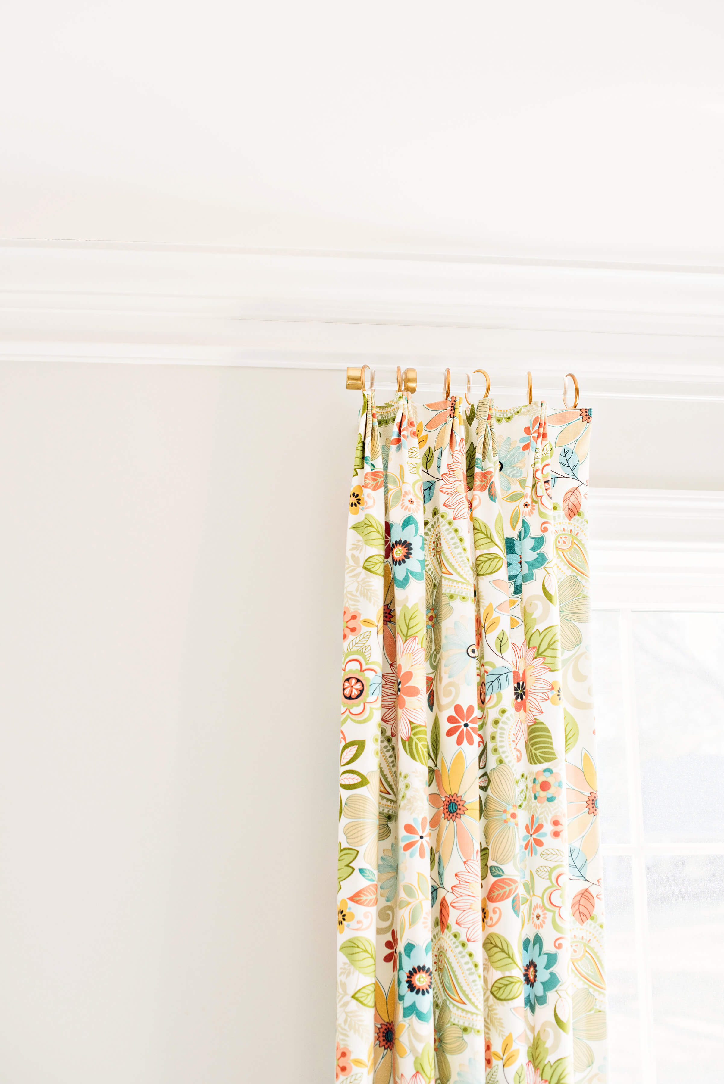 Floral curtains on white rod in sitting room in Bryn Mawr PA