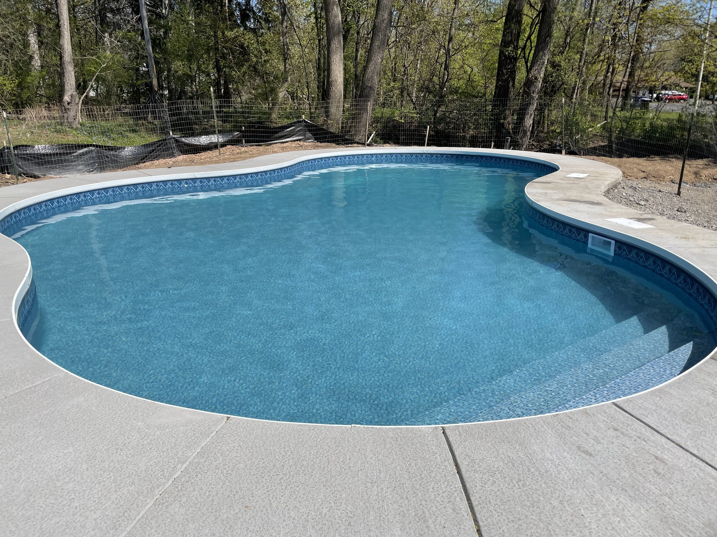 Professional pool opening in Pittsford, NY by The Handy Family team.