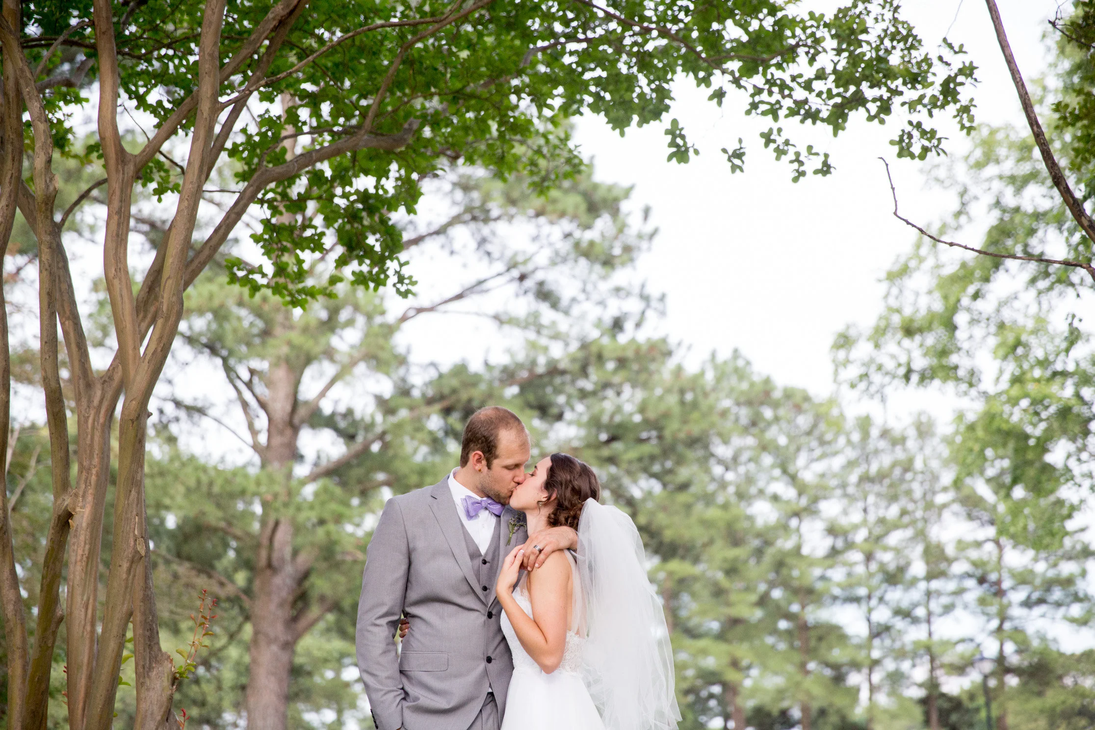 Logan and Laura pose for some gorgeous shots outside Colonial Country Club before their wedding ceremony. 