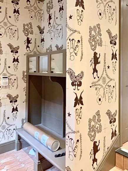 Boston entryway featuring NAMA ROCOCO Amsterdam wallpaper in a custom color way.  Lion Crest design.